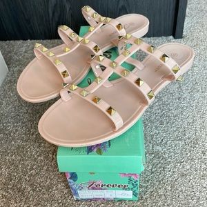 Nude studded jelly sandals